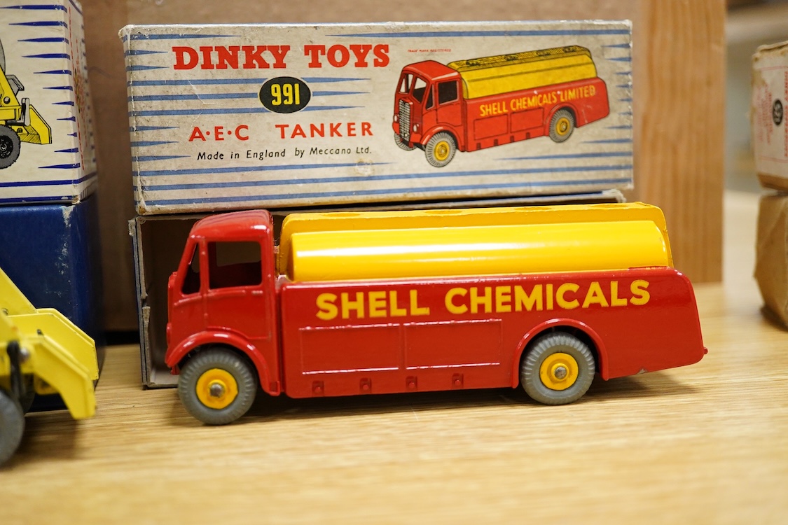 Five boxed Dinky Toys and Supertoys; Bedford Articulated Lorry in yellow (521), Leyland Cement Wagon (933), AEC tanker (991), Plymouth USA taxi (265) and Marrel Multi-Bucket Unit (966)